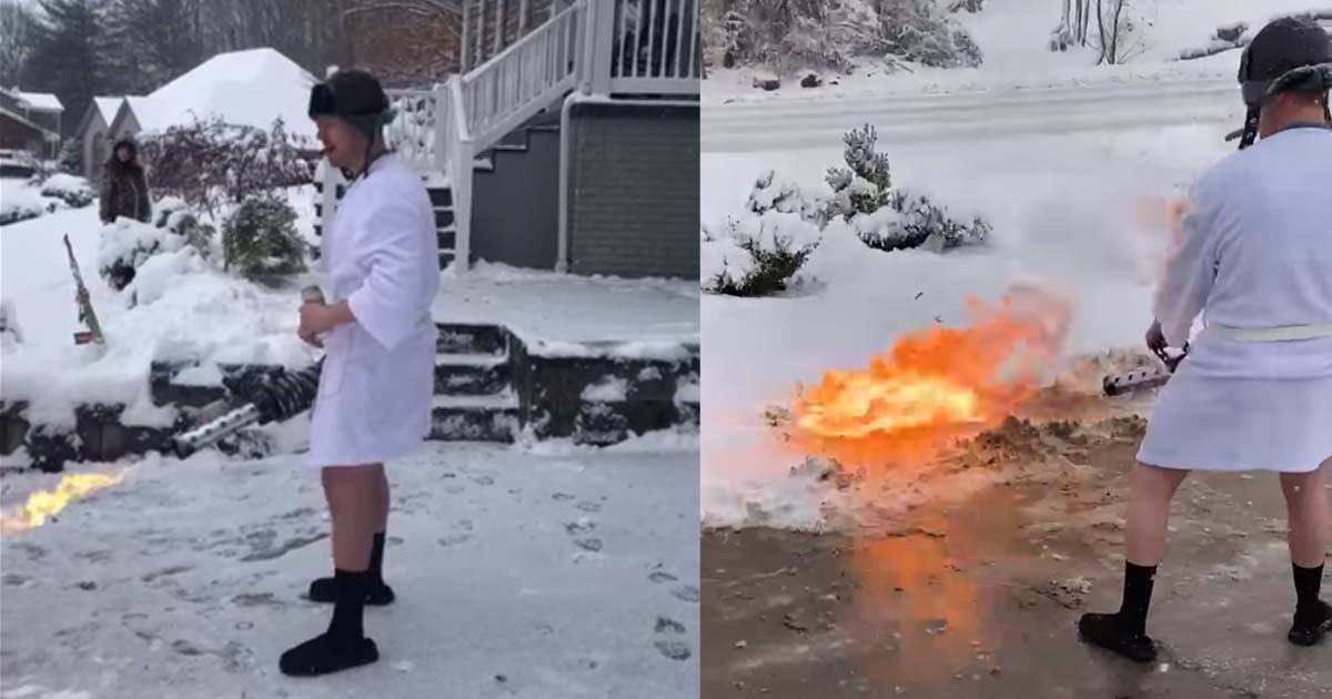 Pulisce il vialetto dalla neve con il lanciafiamme, bevendo birra e fumando un sigaro